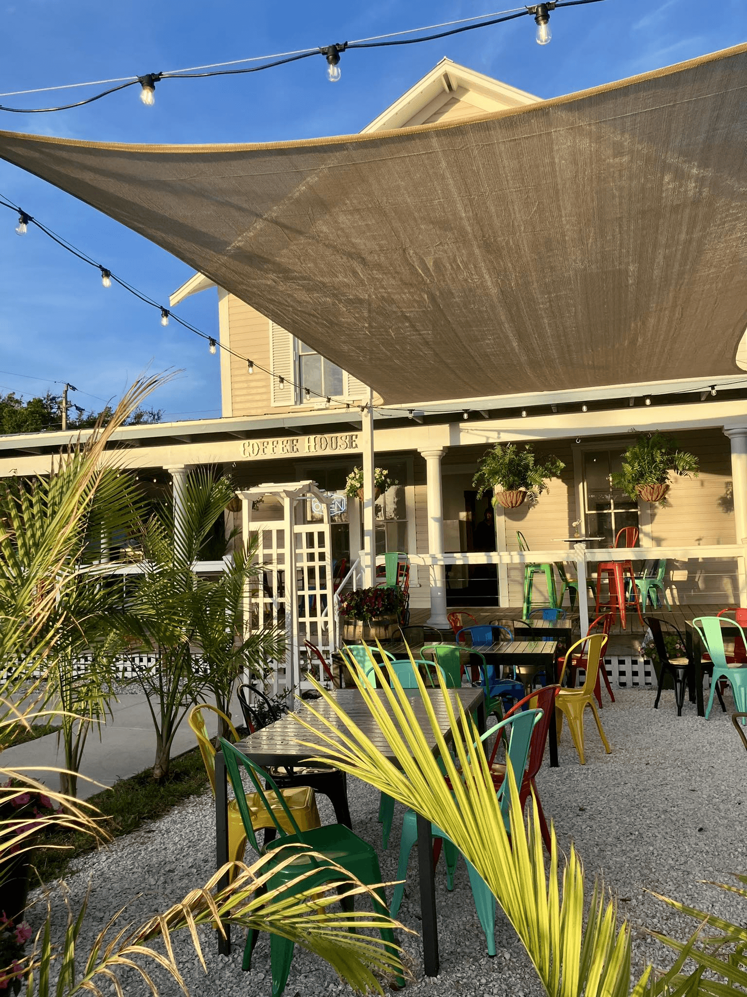 Mismatched bistro chairs on the wraparound porch